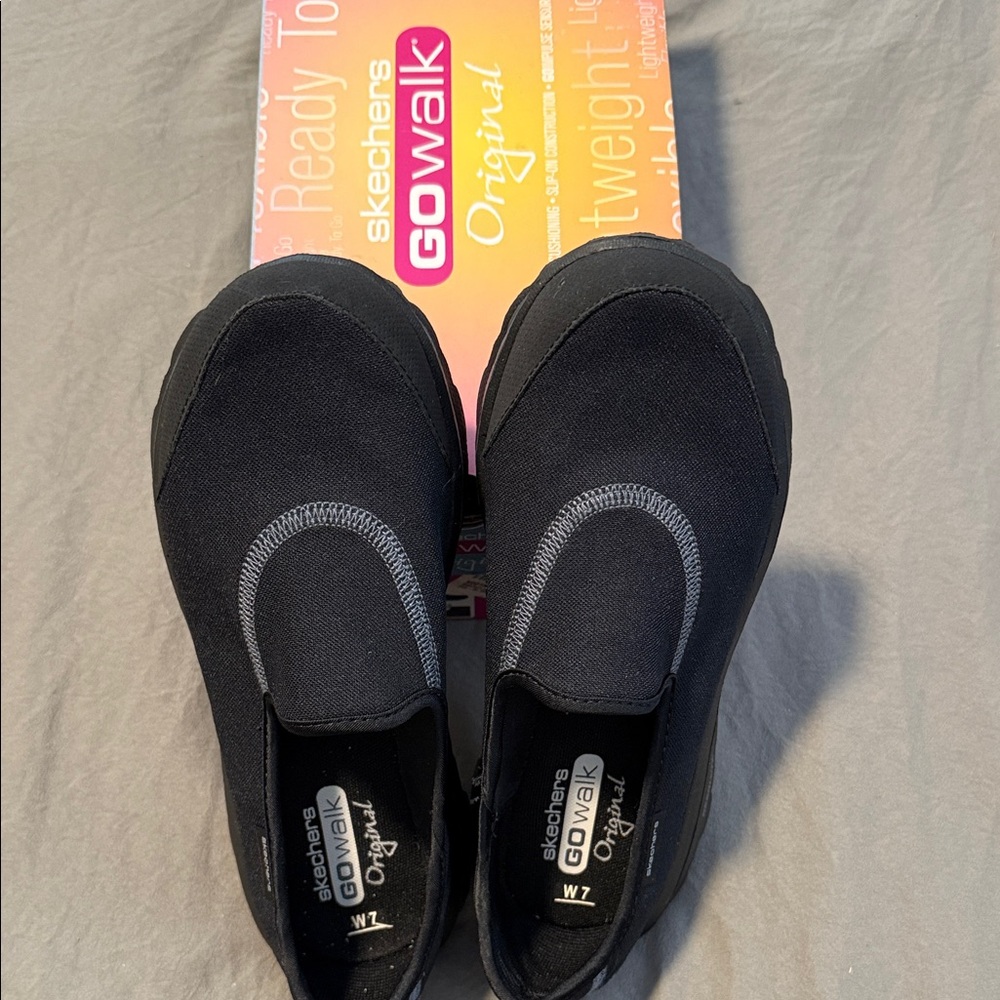 Skechers Women's GOwalk Black Slip-On Sneakers